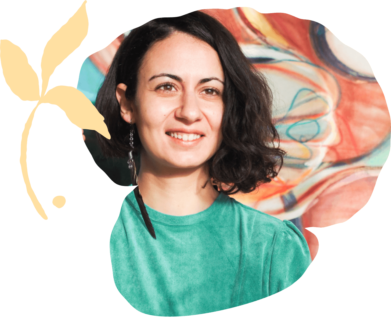 Adamantia Klonaris smiling in front of a colorful abstract painting.